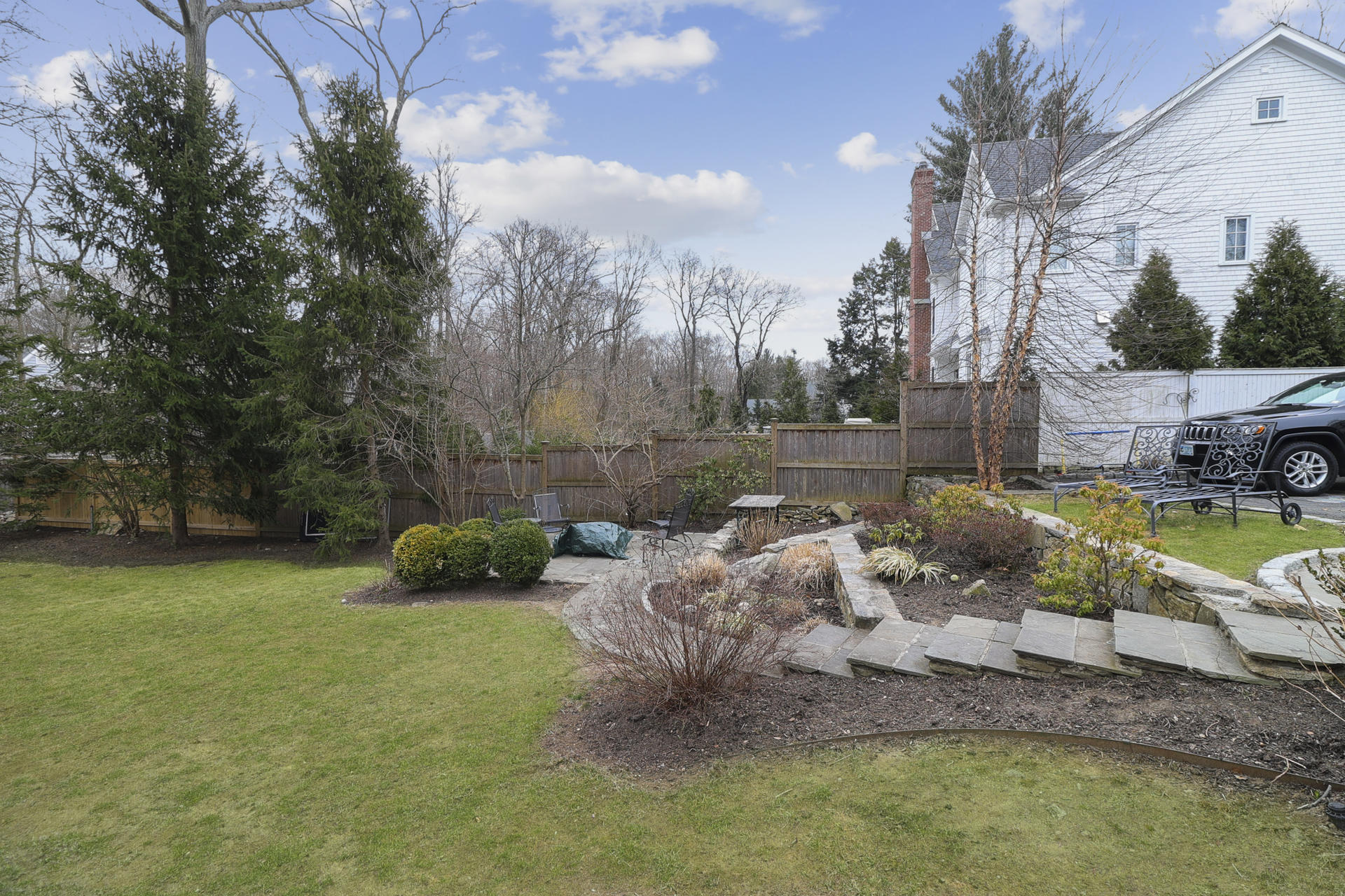 22 Birch Road Darien, CT 06820 - Photo 34 of 40 a view of backyard with swimming pool and seating