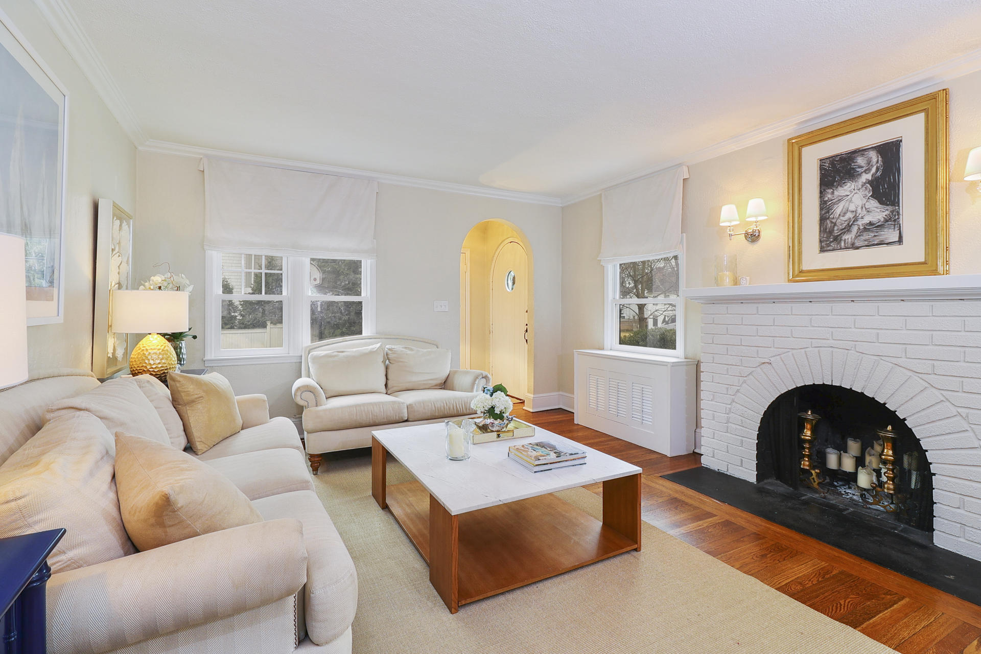 22 Birch Road Darien, CT 06820 - Photo 5 of 40 a living room with furniture a fireplace and a large window