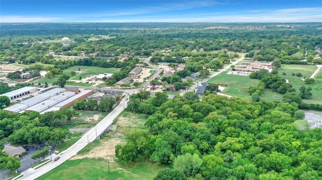 a view of city with ocean