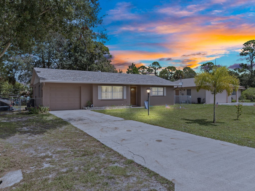 7304 Arthurs Road Fort Pierce, FL 34951 - Photo 1 of 29 front view of a house with a yard