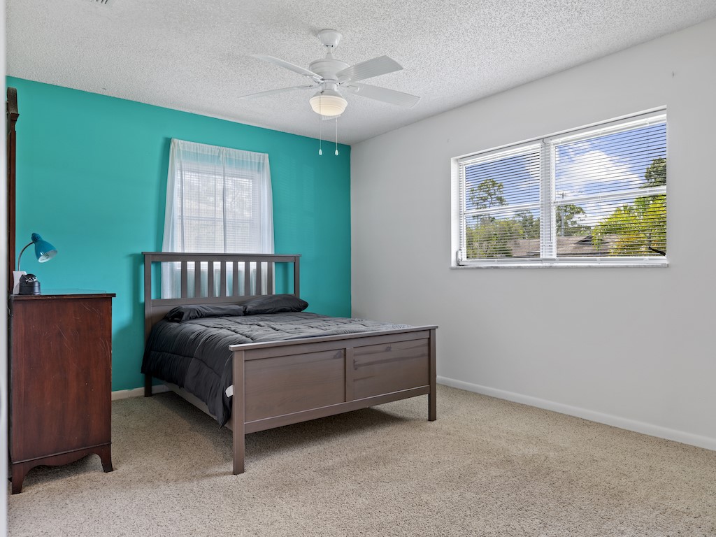 7304 Arthurs Road Fort Pierce, FL 34951 - Photo 18 of 29 a bedroom with a bed and a window