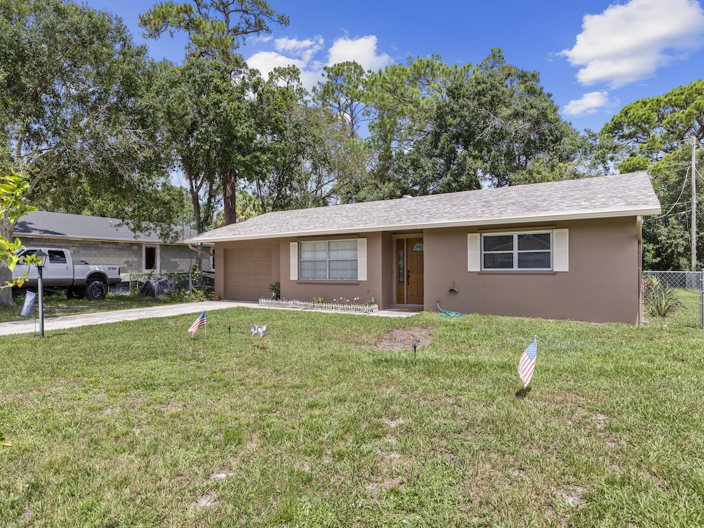 7304 Arthurs Road Fort Pierce, FL 34951 - Photo 28 of 29 a house view with a garden space