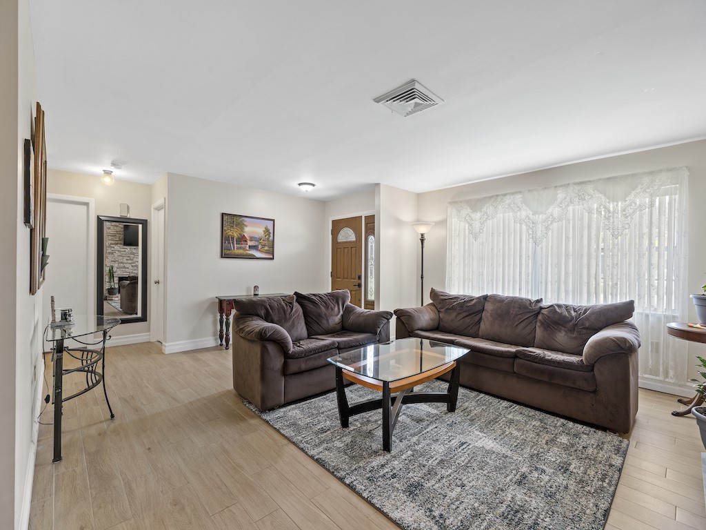 7304 Arthurs Road Fort Pierce, FL 34951 - Photo 5 of 29 a living room with furniture and a couch