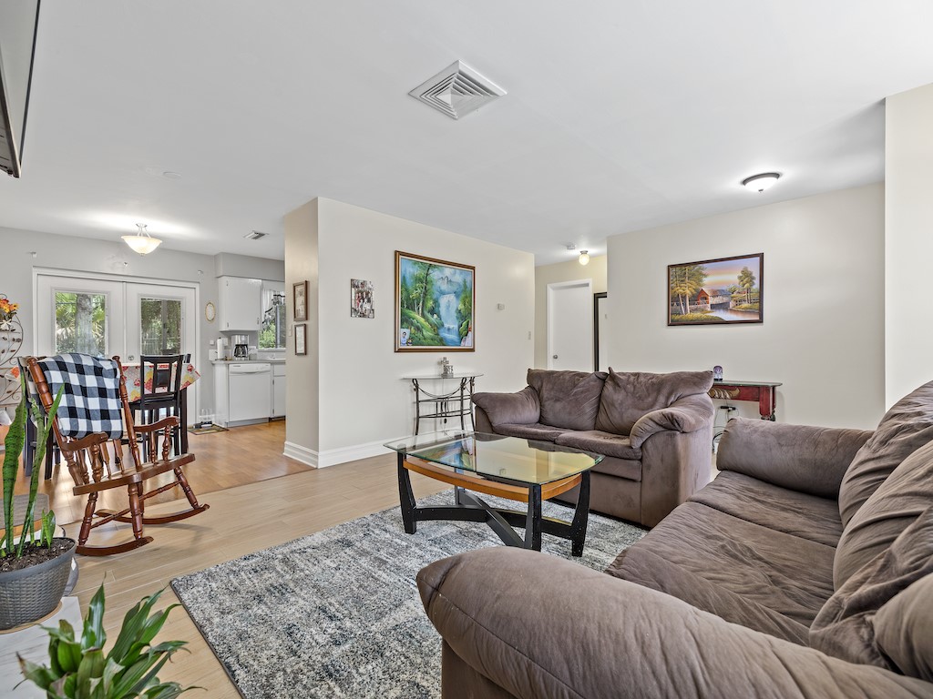 7304 Arthurs Road Fort Pierce, FL 34951 - Photo 8 of 29 a living room with furniture and wooden floor