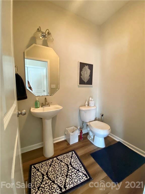 8009 Bryson Road Indian Land, SC 29707 - Photo 16 of 45 a bathroom with a sink toilet and a mirror