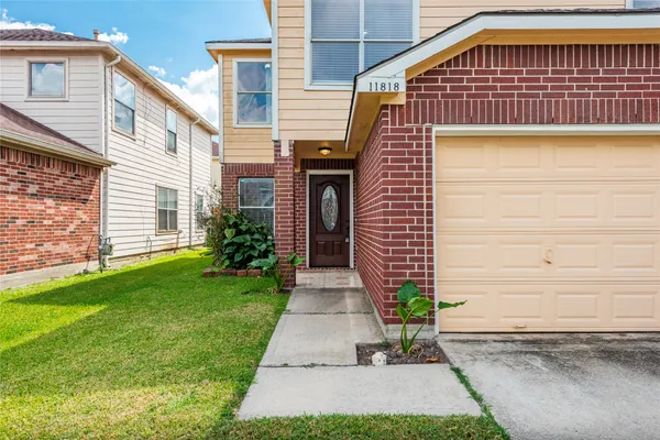 a front view of a house with garden