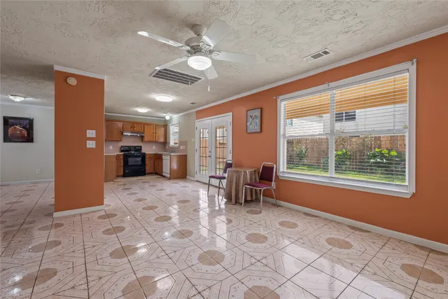 a view of a livingroom with furniture and a kitchen