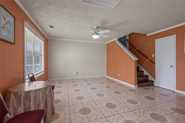 a view of an empty room with windows