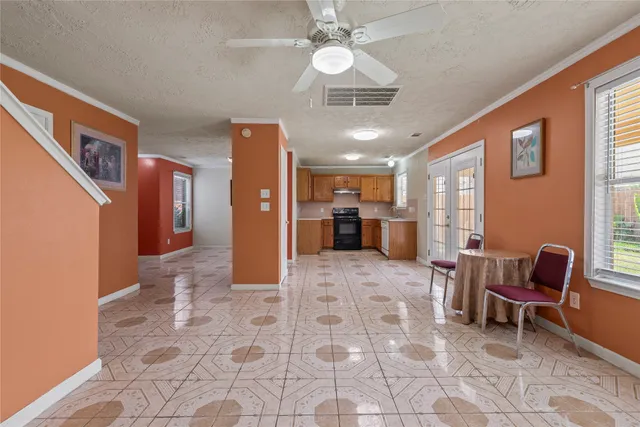 a view of a livingroom with furniture and a kitchen