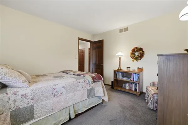 a bedroom with a bed and a cabinets