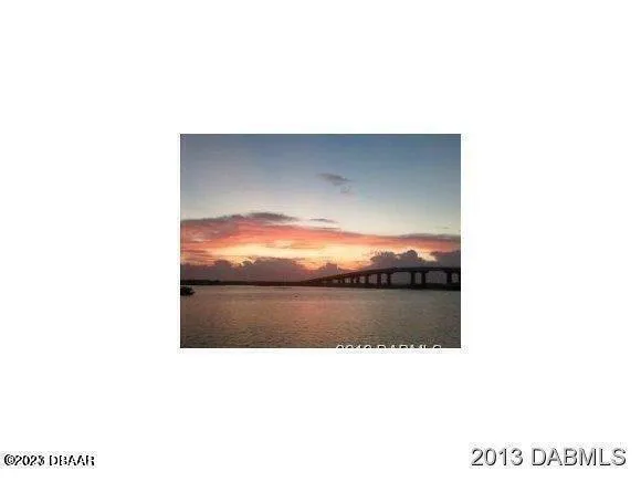 a bathroom with a sink and a painting