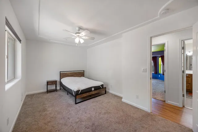 a room with pool table and window