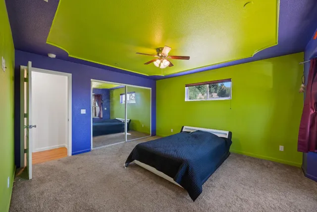 a bed room with a bed and a chandelier