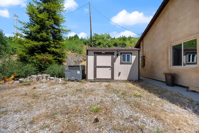 a house with trees in the background
