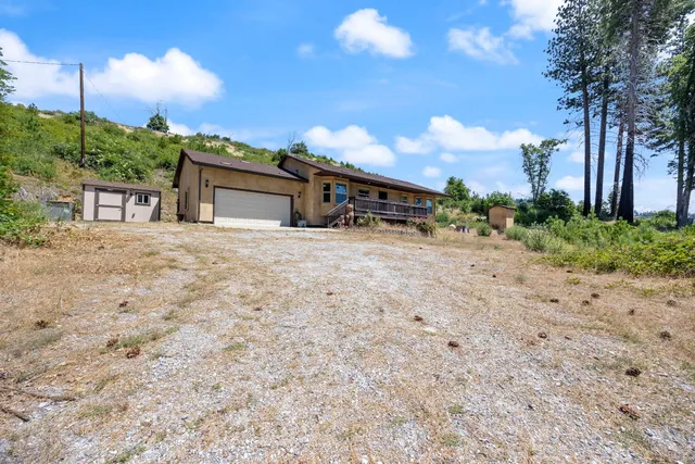 a house with trees in the background