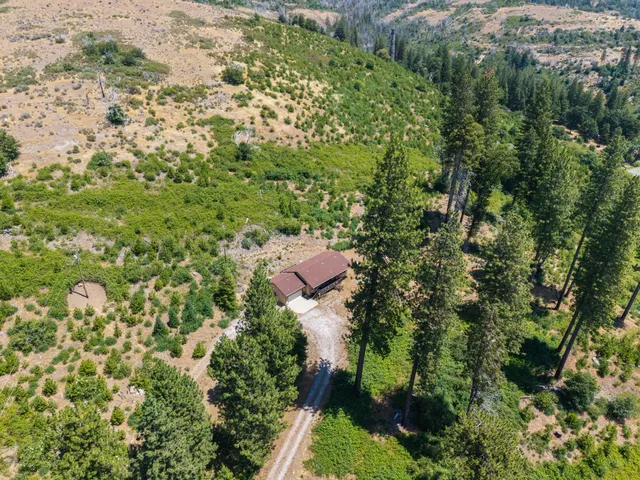 an aerial view of residential house with outdoor space