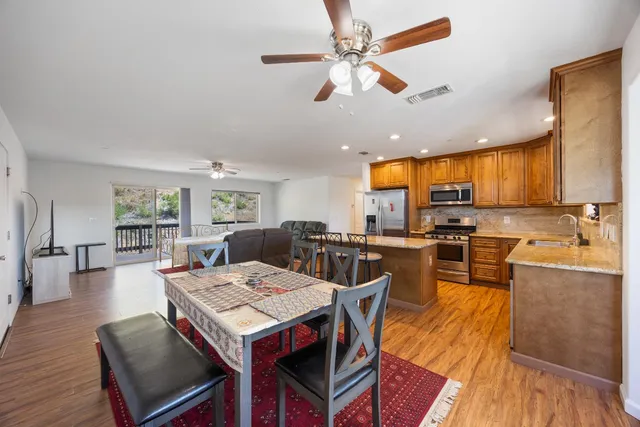 a view of a dining room with furniture window and wooden floor