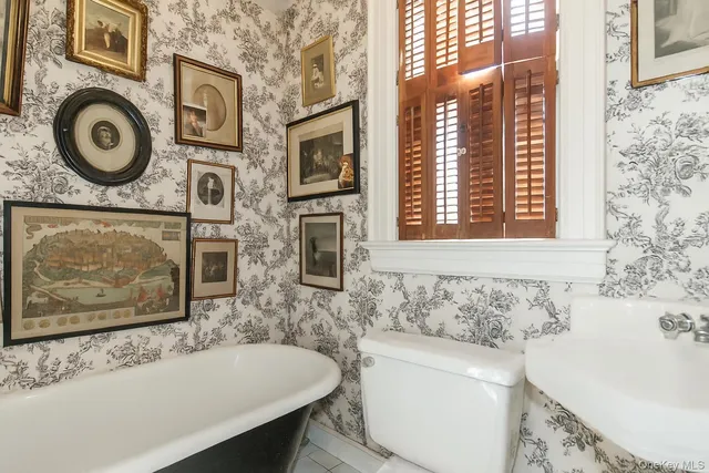 a bathroom with a bathtub and a sink