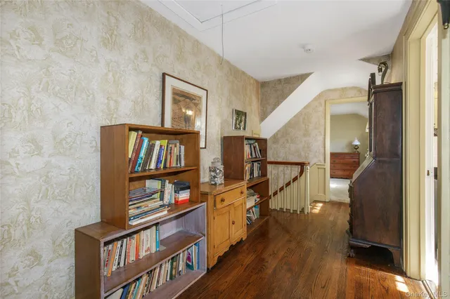 a view of an entryway with wooden floor