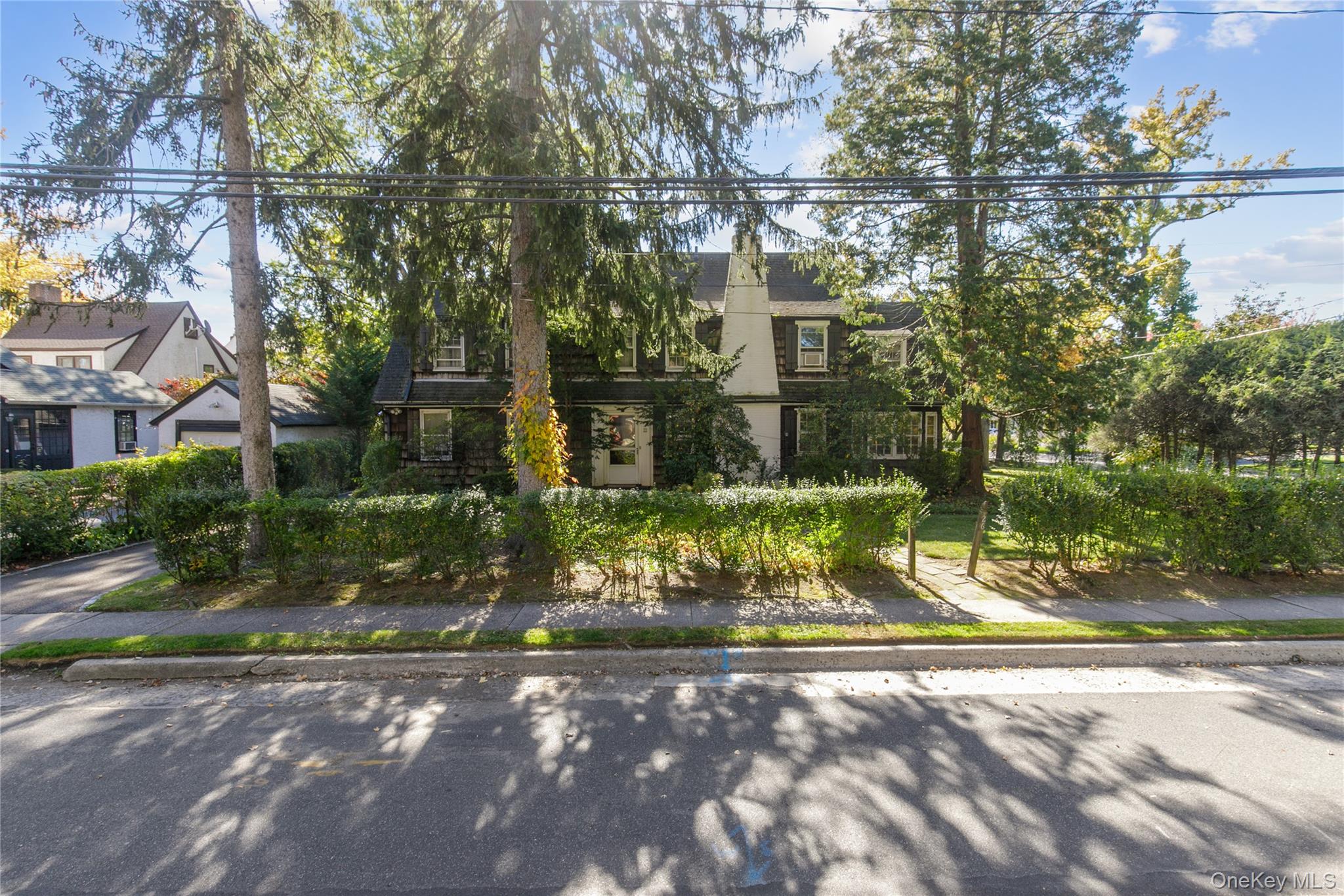 26 Vista Hill Road Great Neck, NY 11021 - Photo 2 of 35 a view of a fountain with large trees