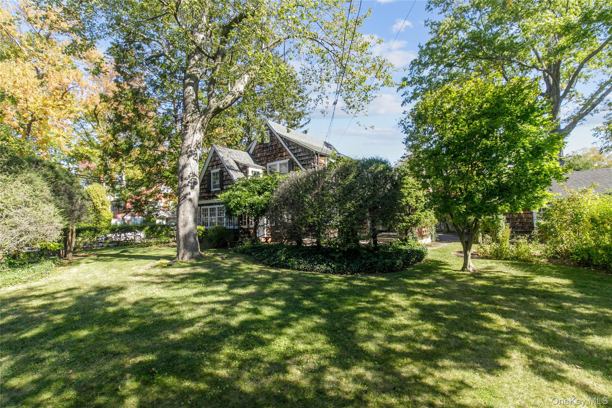 26 Vista Hill Road Great Neck, NY 11021 - Photo 28 of 35 a view of a tree in a yard