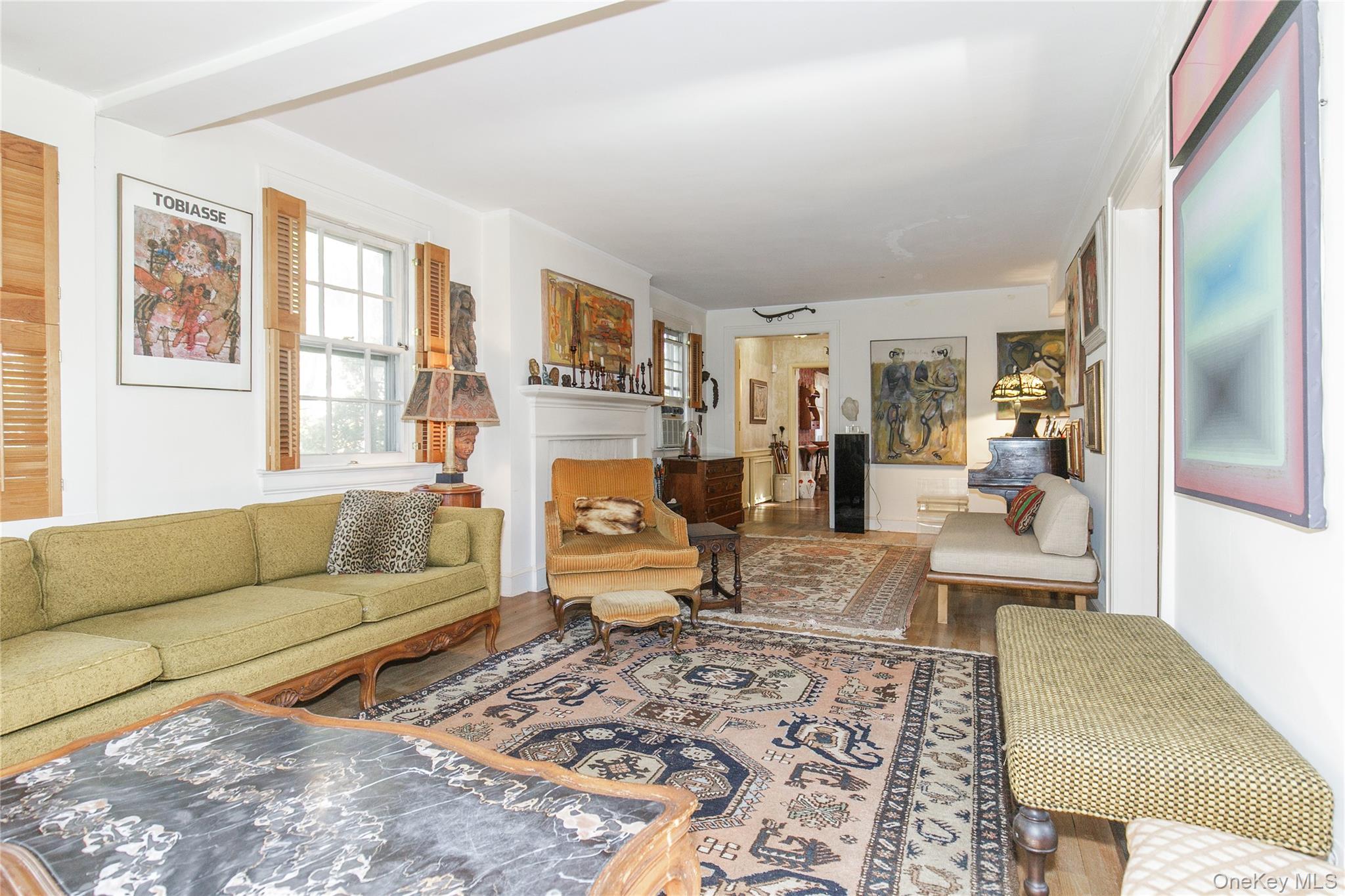 26 Vista Hill Road Great Neck, NY 11021 - Photo 6 of 35 a living room with furniture wooden floor and a large window