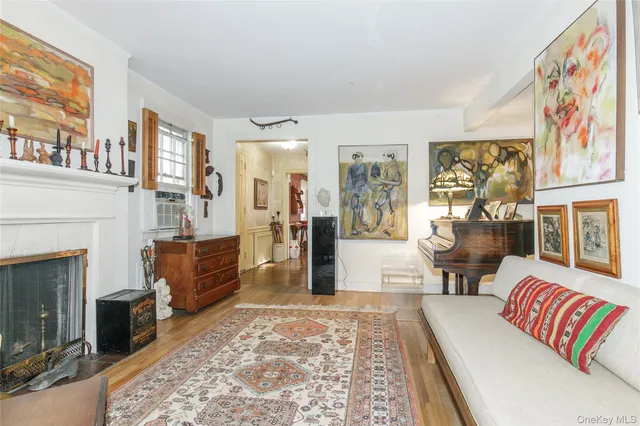 a living room with furniture or couch and a fireplace