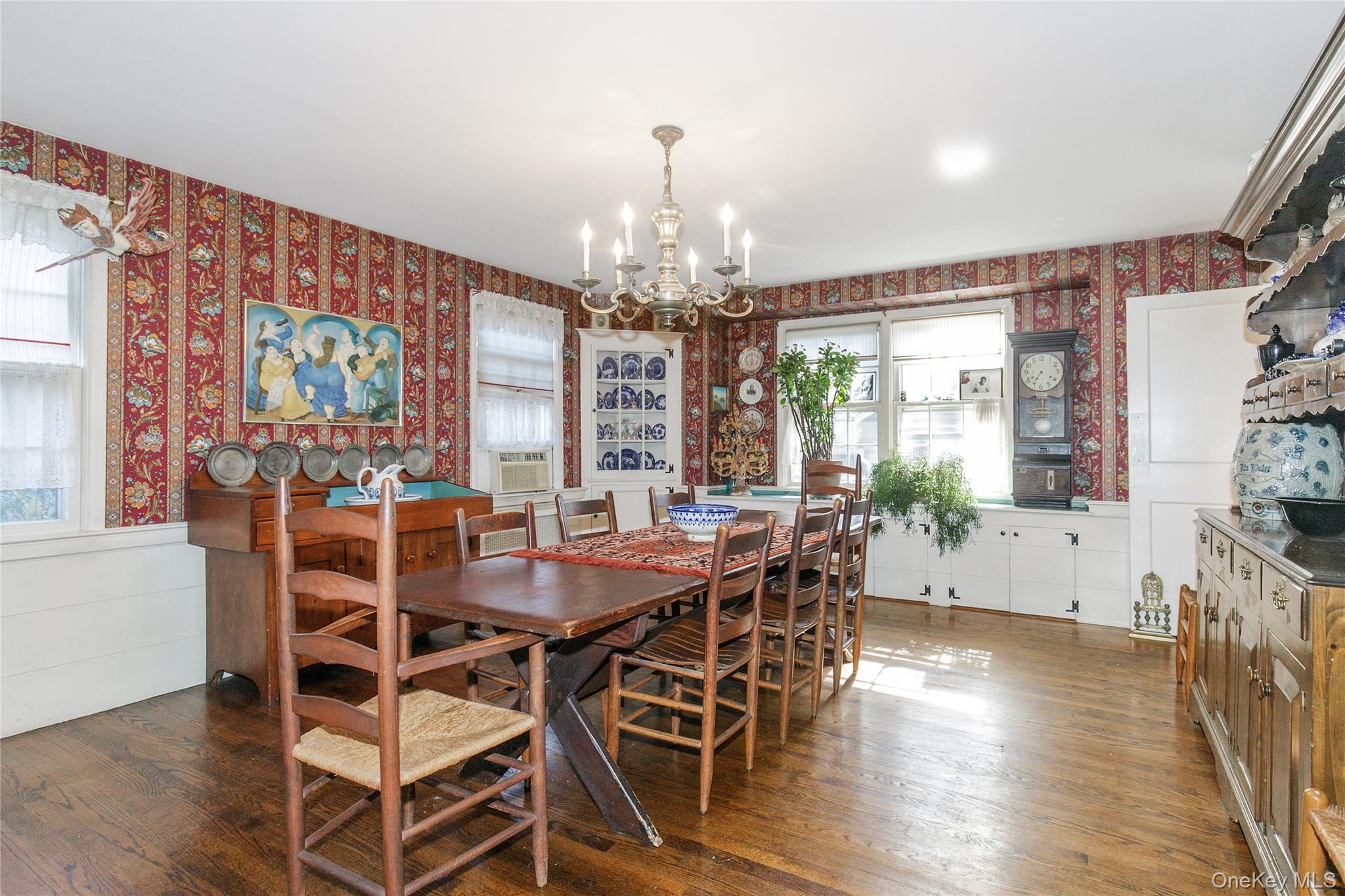 26 Vista Hill Road Great Neck, NY 11021 - Photo 10 of 35 a view of a dining room with furniture wooden floor and chandelier