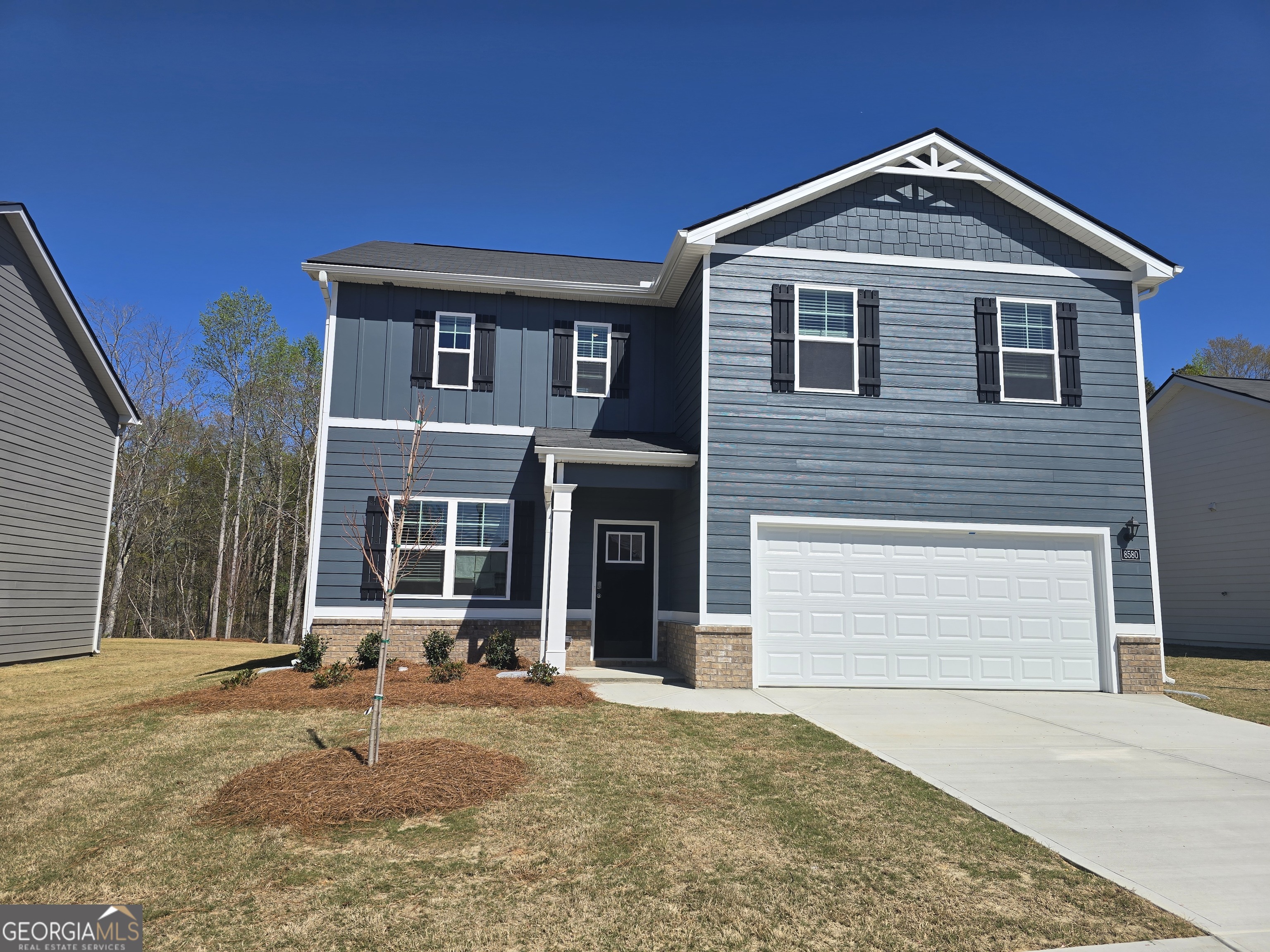 8578 Seabiscuit Road Lithonia, GA 30058 - Photo 1 of 4 a front view of a house with a yard