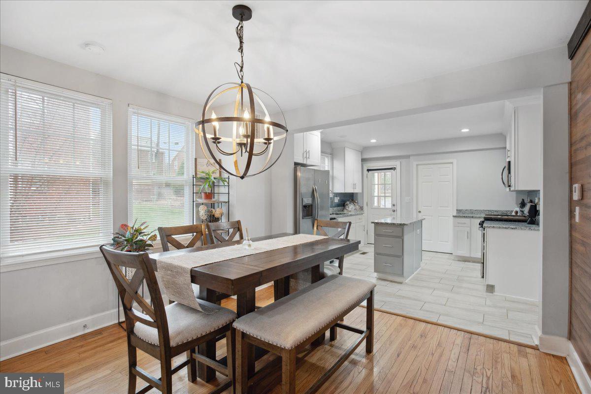22 Cedarwood Road Catonsville, MD 21228 - Photo 11 of 44 a view of a dining room with furniture window and wooden floor