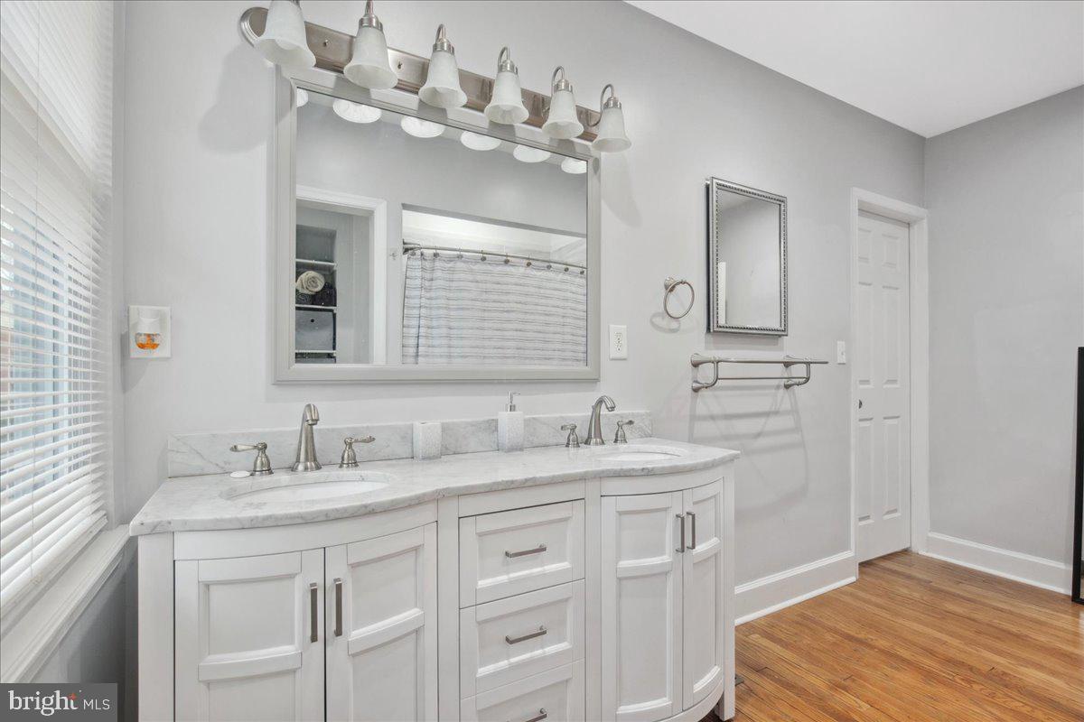 22 Cedarwood Road Catonsville, MD 21228 - Photo 21 of 44 a bathroom with a sink vanity and mirror