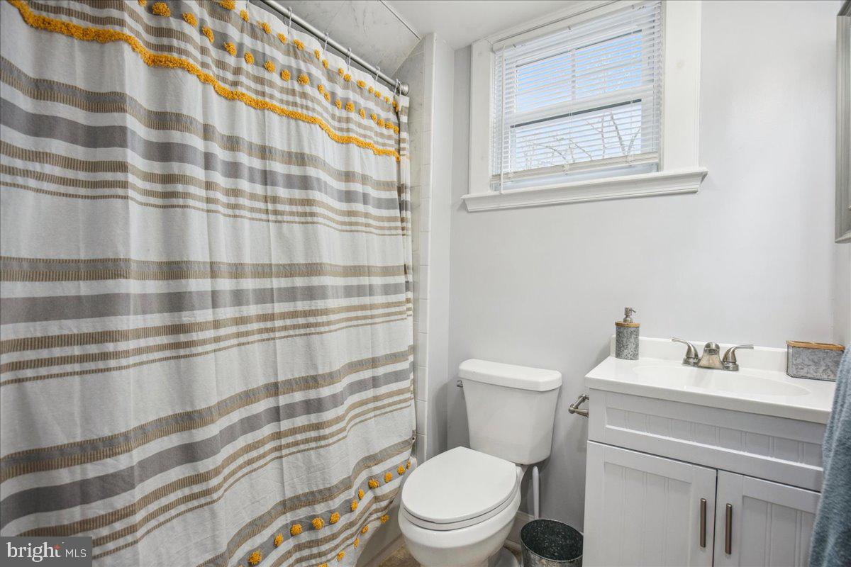 22 Cedarwood Road Catonsville, MD 21228 - Photo 31 of 44 a bathroom with a sink toilet and shower