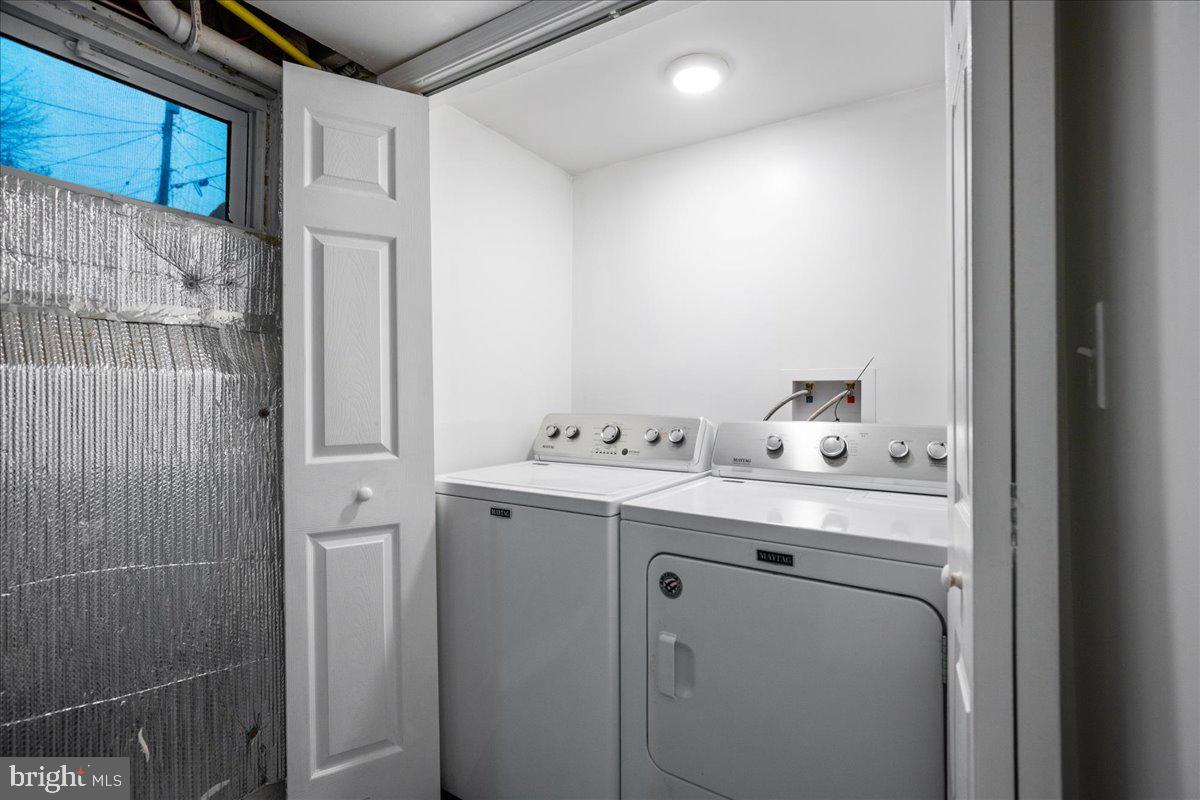 22 Cedarwood Road Catonsville, MD 21228 - Photo 35 of 44 a utility room with dryer and washer