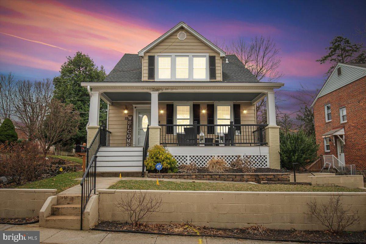 22 Cedarwood Road Catonsville, MD 21228 - Photo 4 of 44 a front view of a house with a yard