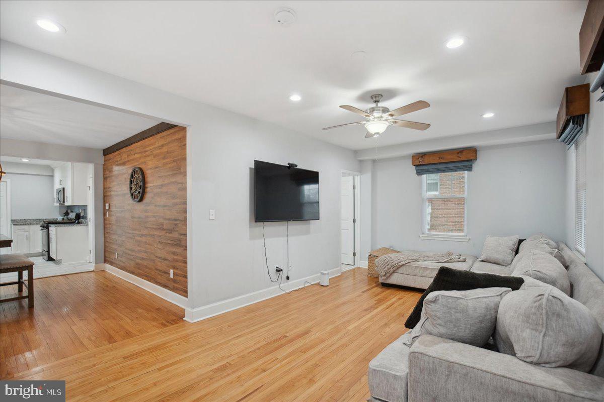 22 Cedarwood Road Catonsville, MD 21228 - Photo 6 of 44 a living room with furniture and a flat screen tv