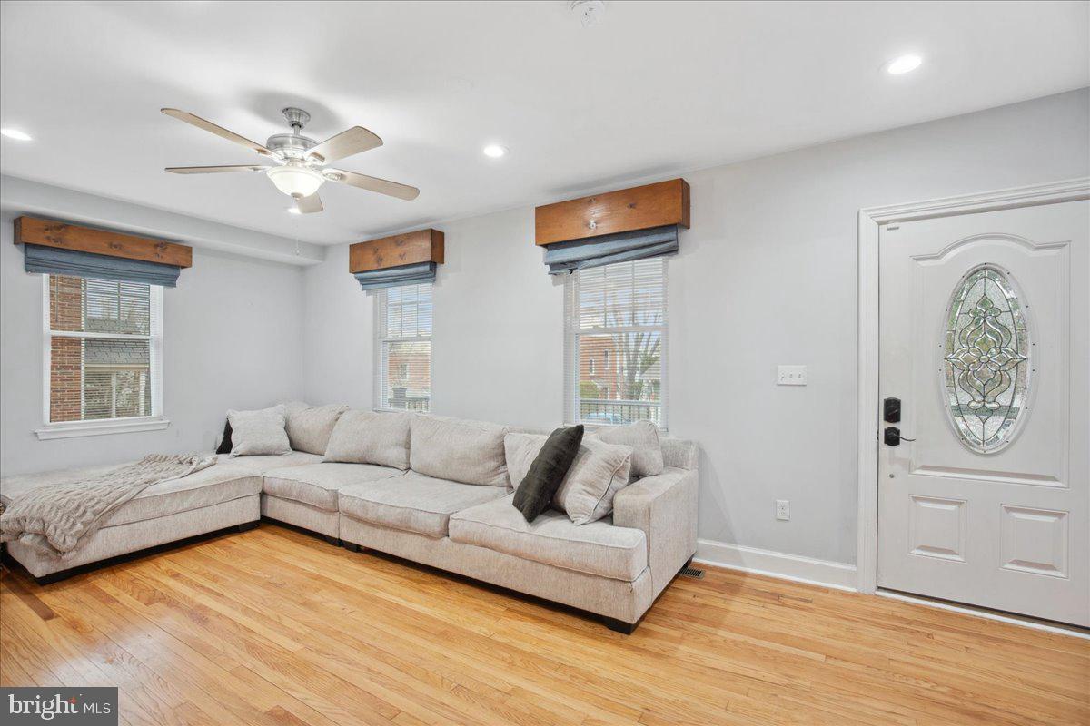 22 Cedarwood Road Catonsville, MD 21228 - Photo 7 of 44 a living room with furniture and a wooden floor