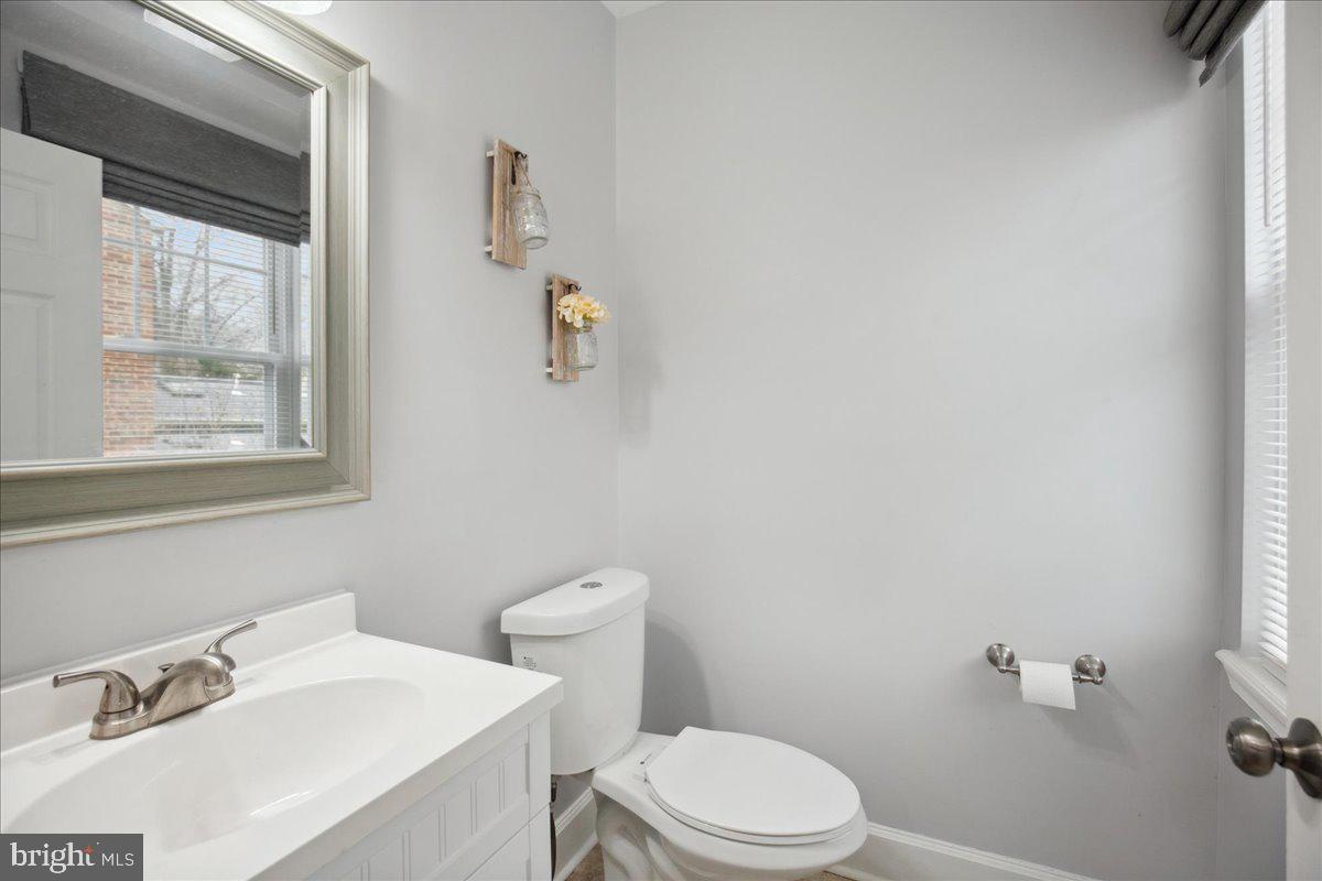 22 Cedarwood Road Catonsville, MD 21228 - Photo 10 of 44 a white toilet sitting next to a bathroom sink