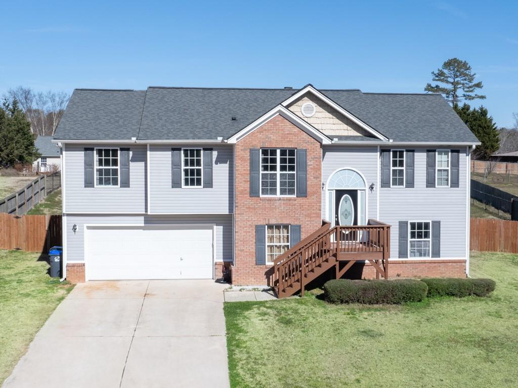 681 Silver Bell Road Jefferson, GA 30549 - Photo 1 of 1 a front view of a house with a yard