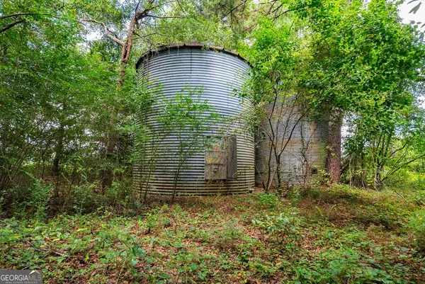 a view of house with a garden