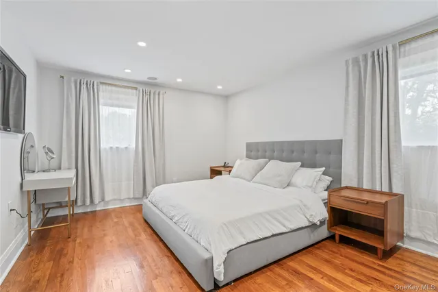 a bedroom with a bed and a table