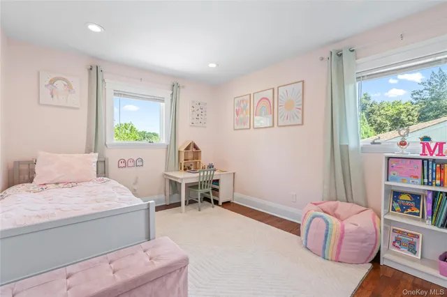a bedroom with a bed and a book shelf