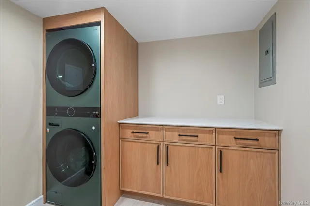 a close view of a utility room with dryer and washer