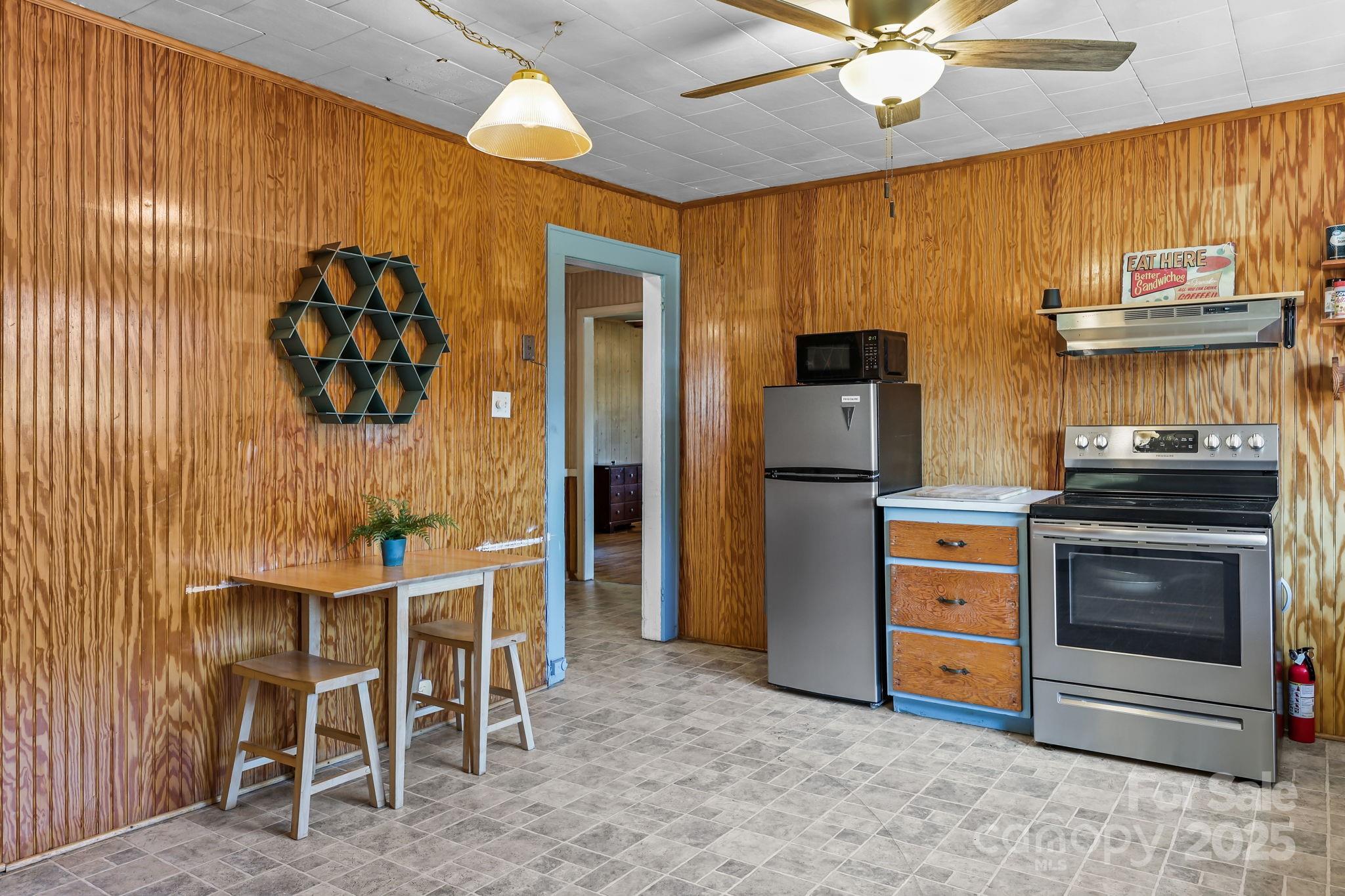 104 Pine Road Mount Holly, NC 28120 - Photo 12 of 46 a kitchen with a table and chairs