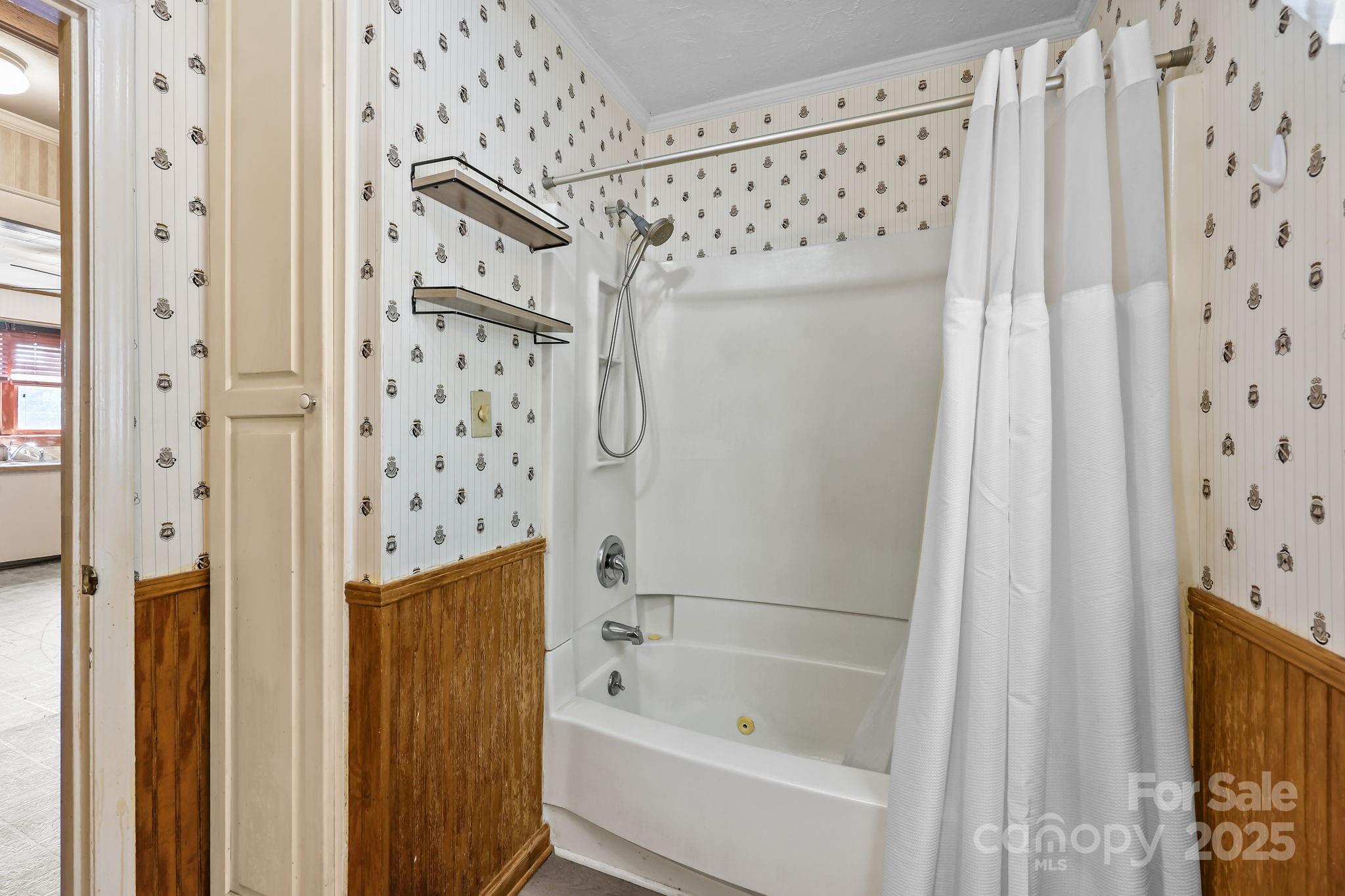 104 Pine Road Mount Holly, NC 28120 - Photo 21 of 46 a bathroom with a shower curtain and a sink