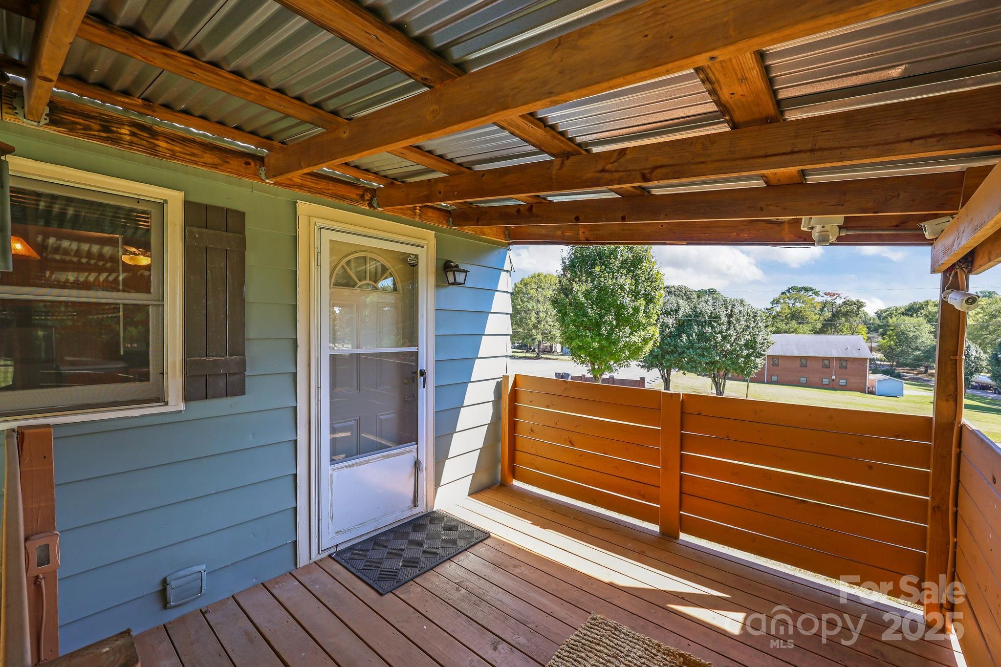 104 Pine Road Mount Holly, NC 28120 - Photo 25 of 46 a view of a room with wooden walls