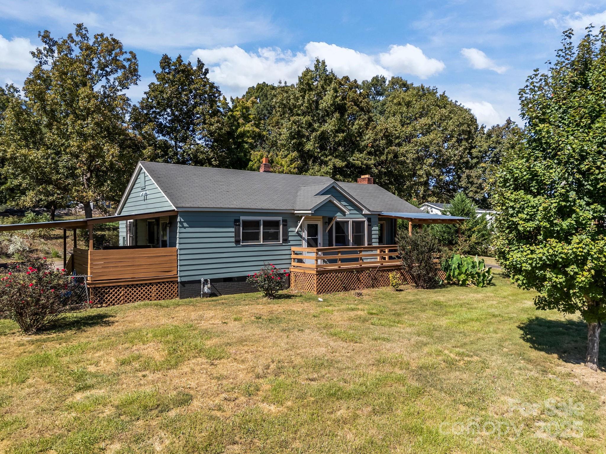 104 Pine Road Mount Holly, NC 28120 - Photo 27 of 46 a front view of a house with yard and green space