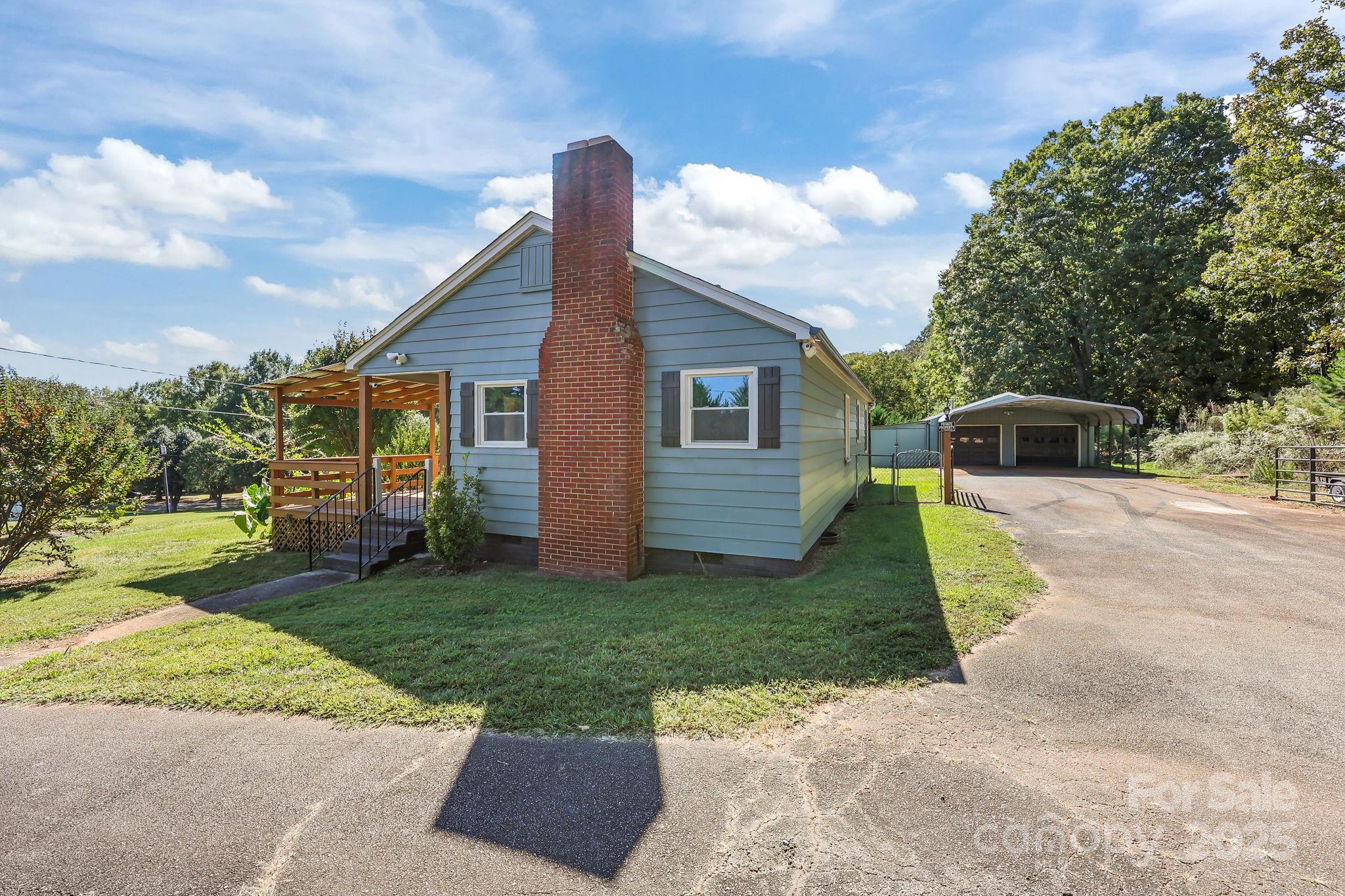 104 Pine Road Mount Holly, NC 28120 - Photo 29 of 46 a front view of a house with garden