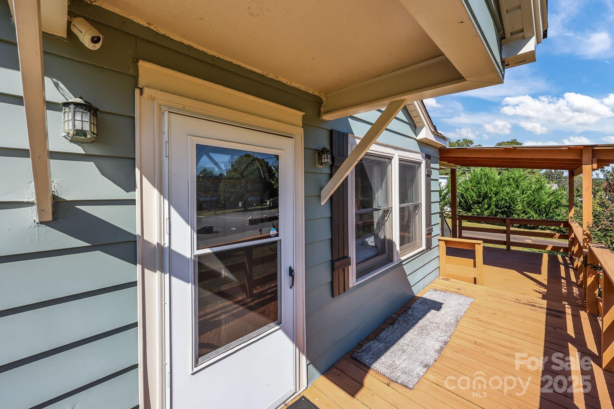 104 Pine Road Mount Holly, NC 28120 - Photo 3 of 46 a view of living room kitchen with furniture and large window