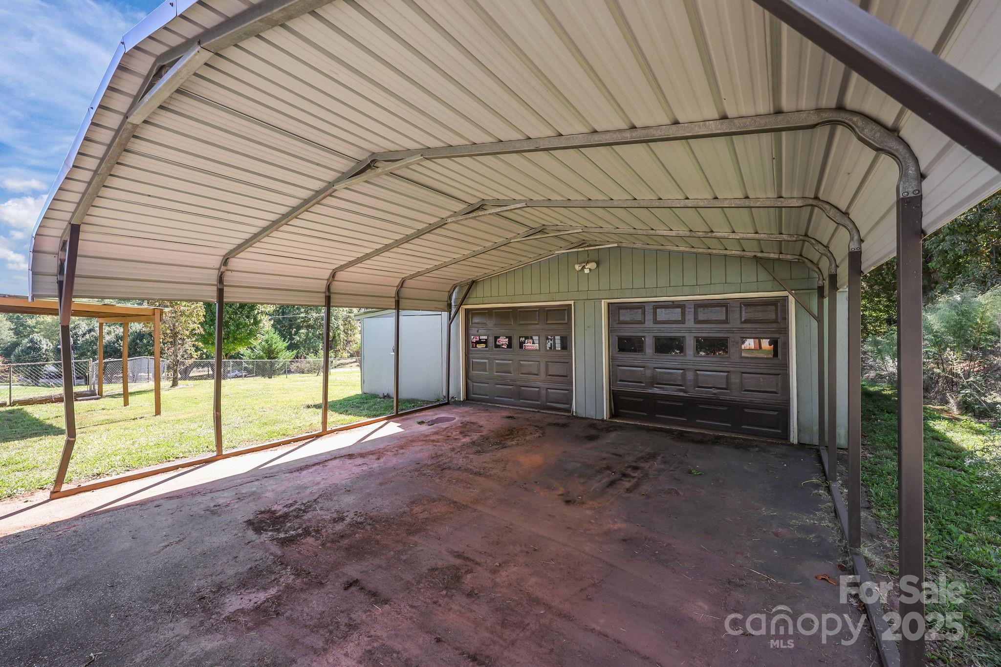 104 Pine Road Mount Holly, NC 28120 - Photo 32 of 46 a view of a house with a porch and balcony