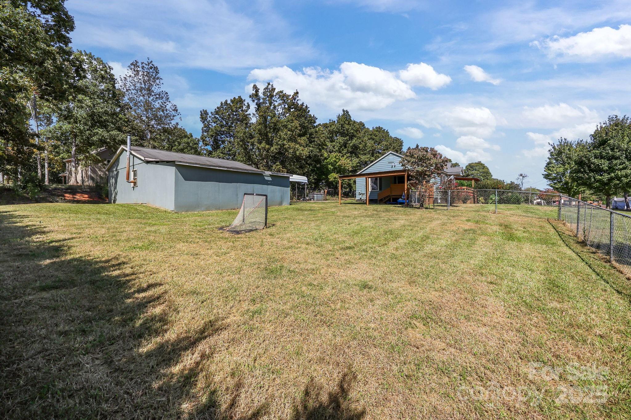 104 Pine Road Mount Holly, NC 28120 - Photo 37 of 46 a view of a house with a yard and covered with snow